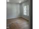 Bright bedroom with new floors, fresh paint and windows that let in tons of natural light at 123-125 Ottawa Dr., Louisburg, NC 27549