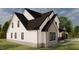 This two-story home features a modern design with ample windows and a well-manicured lawn at 123-125 Ottawa Dr., Louisburg, NC 27549