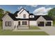 Striking two-story home features a charming front porch and a two-car garage at 123-125 Ottawa Dr., Louisburg, NC 27549