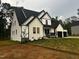 Stylish home with a two-car garage and modern black and white exterior at 123-125 Ottawa Dr., Louisburg, NC 27549