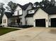 Beautiful home exterior featuring a well-manicured lawn and a two-car garage at 123-125 Ottawa Dr., Louisburg, NC 27549