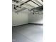 Clean, spacious garage with epoxy flooring and modern door openers at 123-125 Ottawa Dr., Louisburg, NC 27549