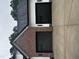 Two-car garage attached to new home featuring brick accents and black garage doors at 123-125 Ottawa Dr., Louisburg, NC 27549