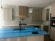 Spacious kitchen featuring modern appliances, custom cabinetry, and an island with a sink at 123-125 Ottawa Dr., Louisburg, NC 27549
