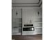Elegant living room boasting custom built-ins, a fireplace, and designer sconces at 123-125 Ottawa Dr., Louisburg, NC 27549