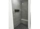 This shower features a built-in niche, a corner seat and stylish dark tile at 123-125 Ottawa Dr., Louisburg, NC 27549