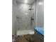 New shower with marble-style tiles, rainfall shower head, and updated fixtures at 123-125 Ottawa Dr., Louisburg, NC 27549