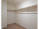 Walk-in closet with ample shelving and carpeting at 1235 Pond Overlook Drive, Nashville, NC 27856