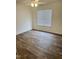 Bedroom with wood floors, a window, and electrical outlets at 1321 Crab Orchard Drive # 203, Raleigh, NC 27606