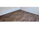 Close up of wood floors with white baseboards at 1321 Crab Orchard Drive # 203, Raleigh, NC 27606