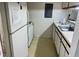 Kitchen with white appliances, countertops, and cabinets at 1321 Crab Orchard Drive # 203, Raleigh, NC 27606