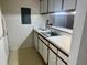 View of kitchen featuring white countertops and cabinets at 1321 Crab Orchard Drive # 203, Raleigh, NC 27606