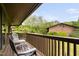 Inviting balcony with outdoor seating, perfect for enjoying serene views of the lush surrounding greenery and blue skies at 1504 Oak Tree Dr, Chapel Hill, NC 27517