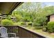 Charming balcony view overlooking the manicured lawn, mature trees, and peaceful community at 1504 Oak Tree Dr, Chapel Hill, NC 27517