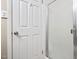 Clean bathroom showcasing a shower with glass door and a white paneled door at 1504 Oak Tree Dr, Chapel Hill, NC 27517