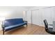 Bedroom with a futon, wood laminate flooring, and double closets at 1504 Oak Tree Dr, Chapel Hill, NC 27517