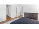 Bright bedroom with wood floors and closet space, featuring a blue comforter at 1504 Oak Tree Dr, Chapel Hill, NC 27517