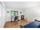 Home office space with a large window, desk, and neutral-colored walls at 1504 Oak Tree Dr, Chapel Hill, NC 27517
