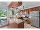 Bright kitchen featuring granite counters, stainless steel appliances, and a large window at 1504 Oak Tree Dr, Chapel Hill, NC 27517