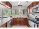 Bright kitchen with granite counters and a stainless steel dishwasher at 1504 Oak Tree Dr, Chapel Hill, NC 27517