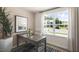 Bright home office features a large window, neutral walls, and stylish decor for a productive workspace at 172 Holmes Corner Dr, Smithfield, NC 27577