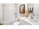 Bright bathroom features a shower-tub combination and a modern vanity with a quartz countertop at 176 Holmes Corner Dr, Smithfield, NC 27577