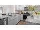 Contemporary kitchen with stainless steel appliances, granite countertops, and ample storage, perfect for culinary enthusiasts at 176 Holmes Corner Dr, Smithfield, NC 27577