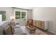 Comfortable living room featuring large window, gray sofa, and natural light at 176 Holmes Corner Dr, Smithfield, NC 27577