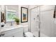 Bathroom with a white vanity, framed mirror and shower with a sliding glass door at 184 Holmes Corner Dr, Smithfield, NC 27577