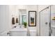 Modern bathroom featuring a vanity with white cabinets and a glass-enclosed shower at 184 Holmes Corner Dr, Smithfield, NC 27577