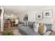 Open-concept living room with a dining area, featuring modern furnishings and neutral color palette at 184 Holmes Corner Dr, Smithfield, NC 27577