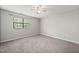 Comfortable bedroom with neutral carpet, natural light, and space to relax at 1903 Malone Rd # E, Burlington, NC 27215