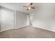 Spacious bedroom with neutral paint, ceiling fan, carpet and convenient closet and ensuite access at 1903 Malone Rd # E, Burlington, NC 27215