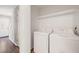 Convenient laundry area with washer, dryer, and shelving for storage solutions at 1903 Malone Rd # E, Burlington, NC 27215