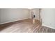 Bright living room boasts wood flooring, neutral paint, and easy access to the kitchen at 1903 Malone Rd # E, Burlington, NC 27215