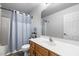 Bathroom featuring updated vanity and bath/shower with decorative tile at 1911 Housatonic Ct, Apex, NC 27523