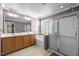 Bright bathroom with double sink vanity, soaking tub, and glass-enclosed shower at 1911 Housatonic Ct, Apex, NC 27523