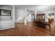 Elegant dining area featuring hardwood floors, classic columns, and staircase at 1911 Housatonic Ct, Apex, NC 27523