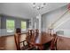 Elegant dining area with hardwood floors, classic furniture and staircase at 1911 Housatonic Ct, Apex, NC 27523