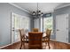 Charming dining room with hardwood floors, chandelier, and natural light at 1911 Housatonic Ct, Apex, NC 27523
