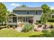 View of the home's exterior with a screened-in porch, patio, and landscaped backyard at 1911 Housatonic Ct, Apex, NC 27523