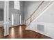 Inviting foyer featuring hardwood floors and a stairway at 1911 Housatonic Ct, Apex, NC 27523