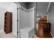 Inviting hallway featuring a mudroom nook with storage, coat hooks, and hardwood flooring at 1911 Housatonic Ct, Apex, NC 27523