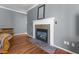 Elegant fireplace with a decorative mantle and slate hearth in the living room at 1911 Housatonic Ct, Apex, NC 27523