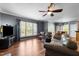 Inviting living room featuring hardwood floors, neutral walls, and sliding glass doors at 1911 Housatonic Ct, Apex, NC 27523