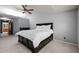 Light filled main bedroom with closet space and neutral walls and ceiling fan at 1911 Housatonic Ct, Apex, NC 27523