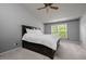 Spacious bedroom with a ceiling fan and window overlooking trees at 1911 Housatonic Ct, Apex, NC 27523