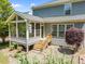 View of the home's screened-in porch and outdoor patio at 1911 Housatonic Ct, Apex, NC 27523