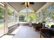 Bright sunroom filled with natural light from many windows and comfortable seating at 1911 Housatonic Ct, Apex, NC 27523