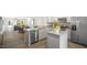 Open-concept kitchen with a dining area and stainless steel appliances creating a welcoming and functional space at 192 Holmes Corner Dr, Smithfield, NC 27577
